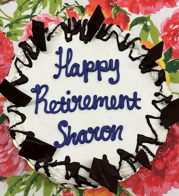 Image of a cake with lettering saying &#039;Happy Retirement Sharon' from my farewell gathering.