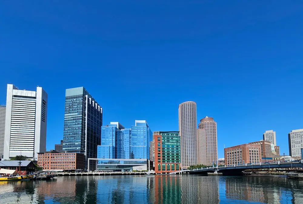 Photo of part of the Boston skyline with a brilliant blue sky, no clouds